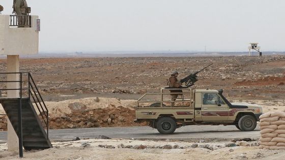 A picture taken during a tour origanized by the Jordanian Army shows soldiers patrolling along the border with Syria to prevent trafficking, on February 17, 2022. - Drug trafficking from Syria into Jordan is becoming "organised" with smugglers stepping up operations and using sophisticated equipment including drones, Jordan's army said, warning of a shoot-to-kill policy. Since the beginning of this year, Jordan's army has killed 30 smugglers and foiled attempts to smuggle into the kingdom from Syria 16 million Captagon pills -- more than they seized in the whole of 2021 -- the military said. (Photo by Khalil MAZRAAWI / AFP) (Photo by KHALIL MAZRAAWI/afp/AFP via Getty Images)