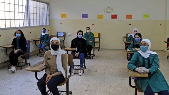 Students, wearing protective masks, sit in a classroom on the first day of school in the Jordanian capital Amman amid the ongoing COVID-19 pandemic, on September 1, 2020. (Photo by Khalil MAZRAAWI / AFP) (Photo by KHALIL MAZRAAWI/AFP via Getty Images)