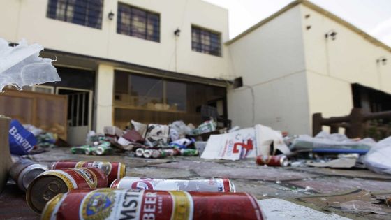 Beer cans are seen on the ground at the Ashurbanipal cultural society in Baghdad after an attack January 16, 2011. Men armed with steel pipes last week raided the Christian social club boasting a bar, and vandalized liquor shops in Baghdad, raising fears of a creeping fundamentalism as Iraq's new government gets to work. Picture taken January 16, 2011. REUTERS/Saad Shalash (IRAQ - Tags: CIVIL UNREST RELIGION)