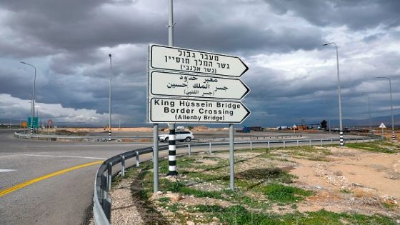 A car drives past a road signal indicating the Allenby (King Hussein) bridge crossing point to Jordan (background), in the city of Jericho in the occupied West Bank, on January 28, 2021. (Photo by AHMAD GHARABLI / AFP) (Photo by AHMAD GHARABLI/AFP via Getty Images)