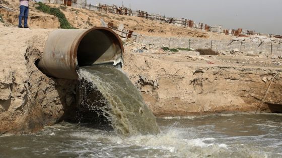 A picture shows a pipe pouring sewage into the Diyala River, east of Baghdad, on January 21, 2024. Stricken by drought, Iraq's already-dwindling rivers are suffocating under medical waste and sewage contamination. (Photo by AHMAD AL-RUBAYE / AFP)