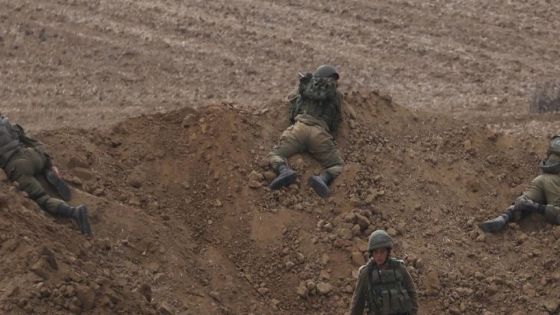 FILE - Israeli soldiers take position near the Israeli Gaza border, southern Israel, Monday, Oct. 9, 2023. (AP Photo/Oren Ziv, File)