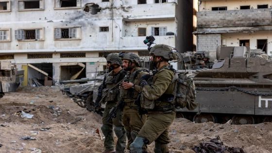 Israeli soldiers stand amid the rubble, during the ongoing ground invasion against Palestinian Islamist group Hamas in the northern Gaza Strip, November 8, 2023. REUTERS/Ronen Zvulun