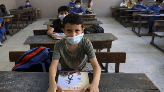 Students wearing protective face masks attend a class at one of the public schools on the first day of the new school year, amid fears of rising number of the coronavirus disease (COVID-19) cases in Amman, Jordan September 1, 2020.