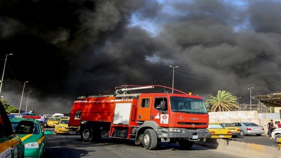 A picture taken on June 10, 2018 shows a fire truck arriving at the scene of a blaze at Iraq's biggest ballot warehouse, where votes for the eastern Baghdad district were stored, in the centre of the capital Baghdad. - The fire ripped through the warehouse before a recount ordered by parliament was to take place, according to a security official, with the cause of the blaze not immediately known. (Photo by SABAH ARAR / AFP) (Photo credit should read SABAH ARAR/AFP/Getty Images)