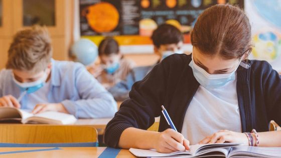 High school students at school, wearing N95 Face masks.
Sitting in a classroom.