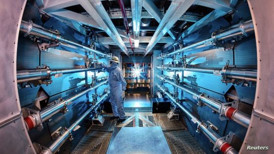 In this 2012 image provided by Lawrence Livermore National Laboratory, a technician reviews an optic inside the preamplifier support structure at the Lawrence Livermore National Laboratory in Livermore, Calif. Officials at the Department of Energy say on Tuesday, Dec. 13, 2022, there will be an announcement of a “major scientific breakthrough” on nuclear fusion. (Damien Jemison/Lawrence Livermore National Laboratory via AP)