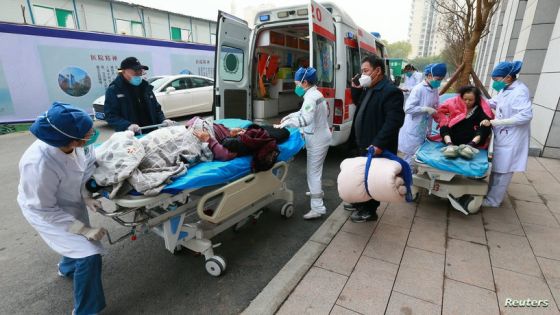 Medical workers of the emergency department transfer a patient of the coronavirus disease (COVID-19) at Suining Central Hospital in Suining, Sichuan province, China December 31, 2022. China Daily via REUTERS ATTENTION EDITORS - THIS IMAGE WAS PROVIDED BY A THIRD PARTY. CHINA OUT.