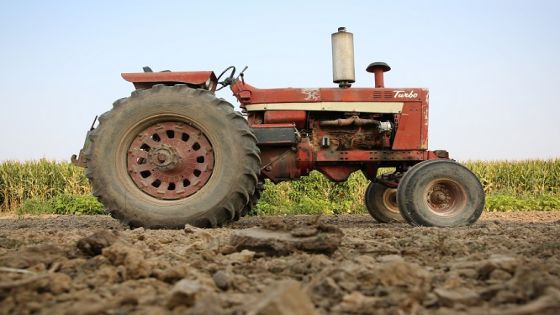 Old tractor sits on an Iowa farm.