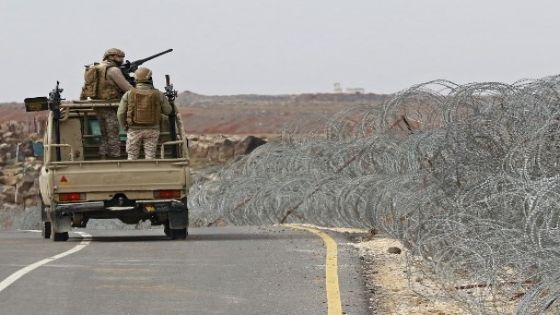 A picture taken during a tour origanized by the Jordanian Army shows soldiers patrolling along the border with Syria to prevent trafficking, on February 17, 2022. - Drug trafficking from Syria into Jordan is becoming "organised" with smugglers stepping up operations and using sophisticated equipment including drones, Jordan's army said, warning of a shoot-to-kill policy. Since the beginning of this year, Jordan's army has killed 30 smugglers and foiled attempts to smuggle into the kingdom from Syria 16 million Captagon pills -- more than they seized in the whole of 2021 -- the military said. (Photo by Khalil MAZRAAWI / AFP)