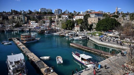 This picture taken on March 12,2022 shows a general view of Kaleici marina in Antalya. - Many in Turkey fear the losses risk being catastrophic in the short term and create logistical nightmares for operators. Industry insiders say the damage wrought by the crisis will depend on many factors including how long the war and flight restrictions last and also to what extent holiday cancellations are balanced by bookings from Russians fleeing into exile. (Photo by Ozan KOSE / AFP)