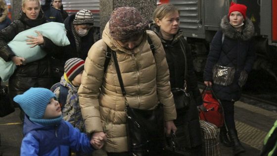 FILE - People from the Donetsk region, the territory controlled by pro-Russia separatist government in eastern Ukraine, leave a train to be taken to temporary housing, at the railway station in Nizhny Novgorod, Russia, Tuesday, Feb. 22, 2022. Over the weekend, separatist officials added a sense of urgency to the picture, announcing mass evacuations of Donetsk and Luhansk residents into Russia and mobilizing troops in the face of a purportedly imminent attack by Ukrainian forces. (AP Photo/Roman Yarovitcyn, File)