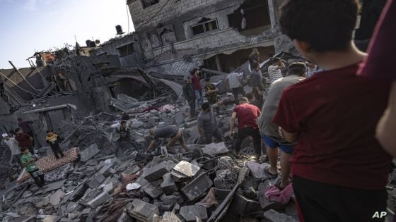 Palestinians look for survivors of the Israeli bombardment in the Maghazi refugee camp in the Gaza Strip, Sunday, Nov. 5, 2023. (AP Photo/Fatima Shbair)