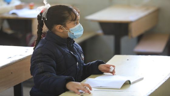 BAGHDAD, IRAQ - DECEMBER 6: A student wears a mask as a measure taken against coronavirus (Covid-19) pandemic attends the lesson at a school in Baghdad, Iraq on December 6, 2020. (Photo by Murtadha Al-Sudani/Anadolu Agency via Getty Images)