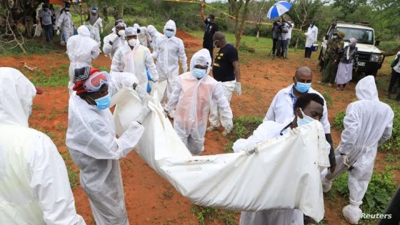 Forensic experts and homicide detectives carry the bodies of suspected members of a Christian cult named as Good News International Church, who believed they would go to heaven if they starved themselves to death, after their remains were exhumed from their graves in Shakahola forest of Kilifi county, Kenya April 22, 2023. REUTERS/Stringer