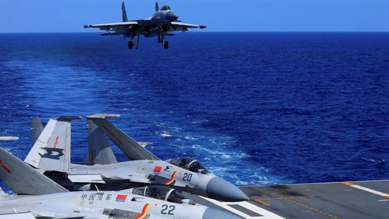 In this photo released Dec. 31, 2021, by Xinhua News Agency, an undated photo shows a carrier-based J-15 fighter jet preparing to land on the Chinese navy's Liaoning aircraft-carrier during open-sea combat training. China is holding military exercises in the disputed South China Sea coinciding with U.S. President Joe Biden's visits to South Korea and Japan that are largely focused on countering the perceived threat from China. (Hu Shanmin/Xinhua via AP)