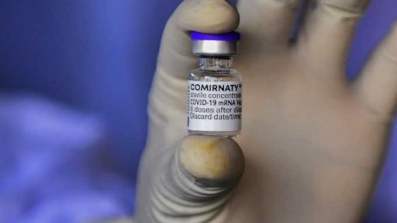 An army health personnel displays a vial of the Pfizer-BioNTech vaccine against the Covid-19 coronavirus in Colombo on July 7, 2021. (Photo by Ishara S. KODIKARA / AFP)