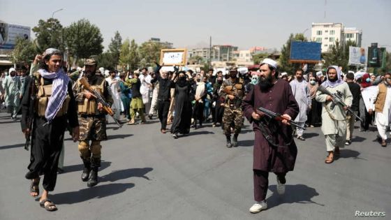 Taliban soldiers stand in front of protesters during the anti-Pakistan protest in Kabul, Afghanistan, September 7, 2021. WANA (West Asia News Agency) via REUTERS ATTENTION EDITORS - THIS IMAGE HAS BEEN SUPPLIED BY A THIRD PARTY. TPX IMAGES OF THE DAY