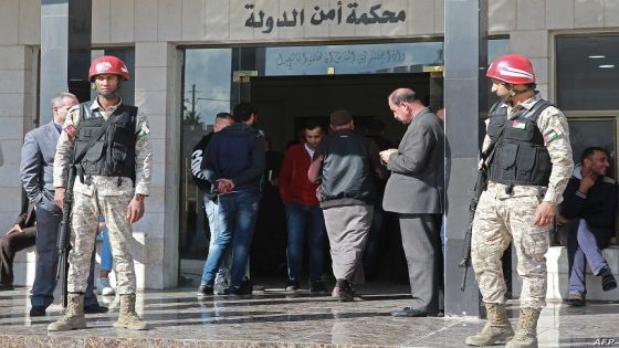 Jordanian security forces guard the court building during the trail of an Israeli man accused of illegally entering Jordan and possession of drugs for consumption, in Amman on December 2, 2019. - Israeli citizen Konstantin Kotov, was arrested in neighbouring Jordan a month ago, is on trial for "illegal entry into the territory of the kingdom (Jordan) and possession of drugs for consumption," officials said. Illegal entry into Jordan is punishable by up to one year in prison, while possession of drugs carries a penalty of up to three. Kotov's arrest comes amid a cooling of ties between Israel and Jordan, one of only two Arab countries to have a peace treaty with the Jewish state. (Photo by AHMAD ABDO / AFP)