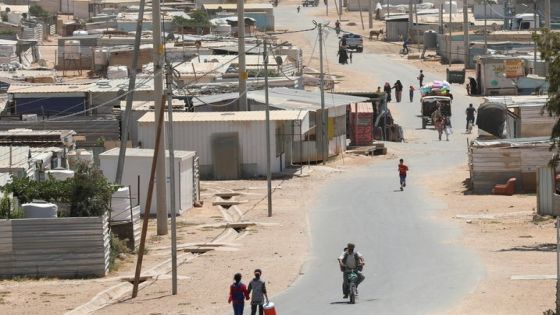 Syrian refugees walk at the Zaatari refugee camp in the Jordanian city of Mafraq, near the border with Syria, Jordan June 17, 2021. Picture taken June 17, 2021. REUTERS/Alaa Al Sukhni