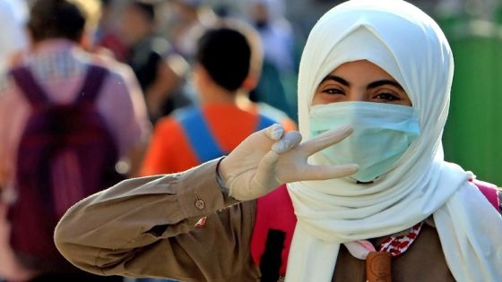 A student attends the first day of school while wearing a protective mask and gloves in the Jordanian capital Amman amid the ongoing COVID-19 pandemic, on September 1, 2020. (Photo by Khalil MAZRAAWI / AFP) (Photo by KHALIL MAZRAAWI/AFP via Getty Images)
