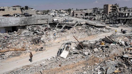 CORRECTION / A man stands by the rubble of a destroyed building in Khan Yunis on April 7, 2024 after Israel pulled its ground forces out of the southern Gaza Strip, six months into the devastating war sparked by the October 7 attacks. Israel pulled all its troops out of southern Gaza on April 7, including from the city of Khan Yunis, the military and Israeli media said, after months of fierce fighting with Hamas militants left the area devastated. (Photo by AFP) / The erroneous mention[s] appearing in the metadata of this photo by - has been modified in AFP systems in the following manner: [Khan Yunis] instead of [Rafah]. Please immediately remove the erroneous mention[s] from all your online services and delete it (them) from your servers. If you have been authorized by AFP to distribute it (them) to third parties, please ensure that the same actions are carried out by them. Failure to promptly comply with these instructions will entail liability on your part for any continued or post notification usage. Therefore we thank you very much for all your attention and prompt action. We are sorry for the inconvenience this notification may cause and remain at your disposal for any further information you may require.