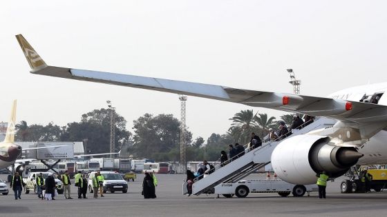 Passengers disembark from their plane after landing at Mitiga airport a few days after militiamen attacked it in an attempt to free colleagues held at a jail there, on the outskirts of the Libyan capital Tripoli, on January 20, 2018. - The Libyan capital's only working international airport reopened today after fighting killed at least 20 people and damaged several planes earlier this week. (Photo by Mahmud TURKIA / AFP) (Photo credit should read MAHMUD TURKIA/AFP/Getty Images)