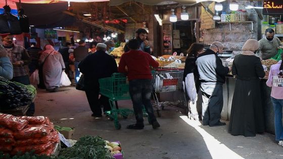 People shop at a public fresh produce market in Jordan's capital Amman, on April 5, 2021, after a rare security operation took place in the country. - Jordan's Prince Hamzah, accused by the government of a "wicked" plot against his elder half-brother King Abdullah II, insisted he will not obey orders restricting his movement. The government has accused him of involvement in a seditious conspiracy to "destabilise the kingdom's security", placed him under house arrest and detained at least 16 more people. (Photo by Khalil MAZRAAWI / AFP) (Photo by KHALIL MAZRAAWI/AFP via Getty Images)