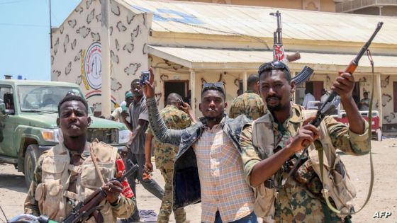 This picture taken on April 16, 2023, shows Sudanese army soldiers, loyal to army chief Abdel Fattah al-Burhan, posing for a picture at the Rapid Support Forces (RSF) base in the Red Sea city of Port Sudan. - Battling fighters in Sudan said they had agreed to an hours-long humanitarian pause, including to evacuate wounded, on the second day of raging urban battles that killed more than 50 civilians including three UN staff and sparking international outcry. (Photo by - / AFP)