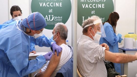 Men receive a Pfizer/BioNTech COVID-19 vaccine dose during a coronavirus vaccination campaign at Lebanese American University Medical Center-Rizk Hospital in Beirut, Lebanon February 16, 2021. REUTERS/Mohamed Azakir