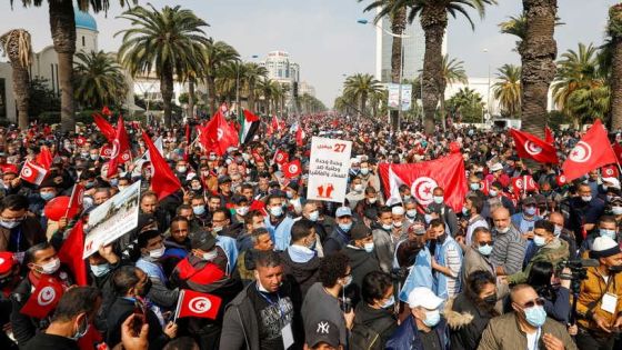 Supporters of Tunisia's biggest political party, the moderate Islamist Ennahda, march during a rally in opposition to President Kais Saied, in Tunis, Tunisia February 27, 2021. REUTERS/Zoubeir Souissi