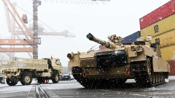 A M1A2 Abrams battle tank of the US army that will be used for military exercises by the 2nd Armored Brigade Combat Team, is unloaded at the Baltic Container Terminal in Gdynia on December 3, 2022. - The military equipment arrived in Poland as part of the Operation Atlantic Resolve, augmenting the air, ground and naval presence along the Eastern flank of the NATO. (Photo by MATEUSZ SLODKOWSKI / AFP)