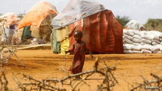 A child walks outside makeshift shelters at the Kaxareey camp for the internally displaced people after they fled from the severe droughts, in Dollow, Gedo Region, Somalia May 24, 2022. Picture taken May 24, 2022. REUTERS/Feisal Omar