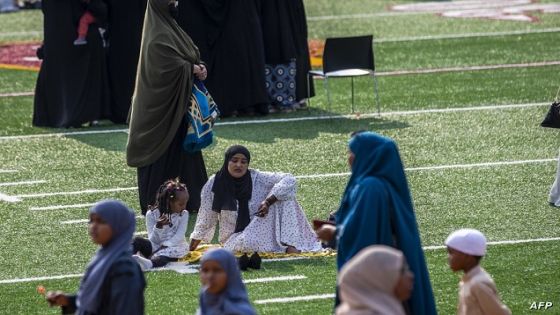 Muslim worshippers gather at the Huntington Bank Stadium during Eid al-Adha prayers and festivities on July 20, 2021 in Minneapolis, Minnesota. - The prayers were the first major gathering for the Muslim community living in Minneapolis after the Covid-19 outbreak, organized by the Abubakar As-saddique Islamic Center. (Photo by Kerem Yucel / AFP)