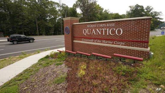 Traffic drives past the entrance sign of Marine Corps Base Quantico Thursday, Aug. 26, 2021, in Quantico, Va. Afghan refugees who have been prescreened by the U.S. Department of Homeland Security have been taken to Quantico, Fort Lee as well as Ft. Pickett. (AP Photo/Steve Helber)