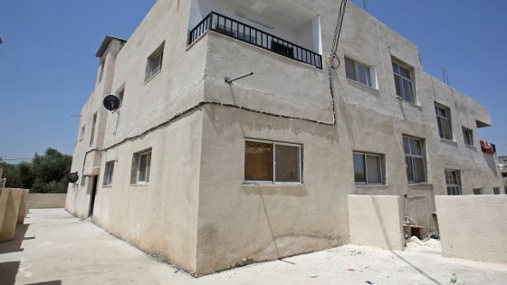 A general view taken on August 9, 2017, shows a building in the northern Jordanian town of Irbid where Syrian refugees are being housed under a programme working in collaboration with a Norwegian NGO and local property owners. The programme, put in place by the Norwegian Refugee Council (CNR), offers to help Jordanians to finish real estate projects or to renovate their properties on the condition that they accept to house Syrian refugees for free for a fixed period of time. / AFP PHOTO / khalil mazraawi